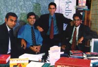 from the left to right, Pingle, Kapoor (in a 
blue shirt, and no jacket), Bhan (standing) and Shariff (sitting, with 
glasses).