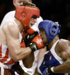 Sebastian Kober lands one on the chin of Felix Savon. REUTERS/Grigory Dukor 