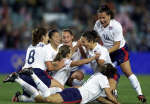 Tiffeny Milbrett (C) is mobbed by her American teammates after scoring the first goal against Norway. REUTERS/Kai Pfaffenbach 