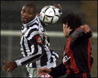 Juventus striker Marcelo Zalayeta (L) and A.C. Milan's Kakha Kaladze